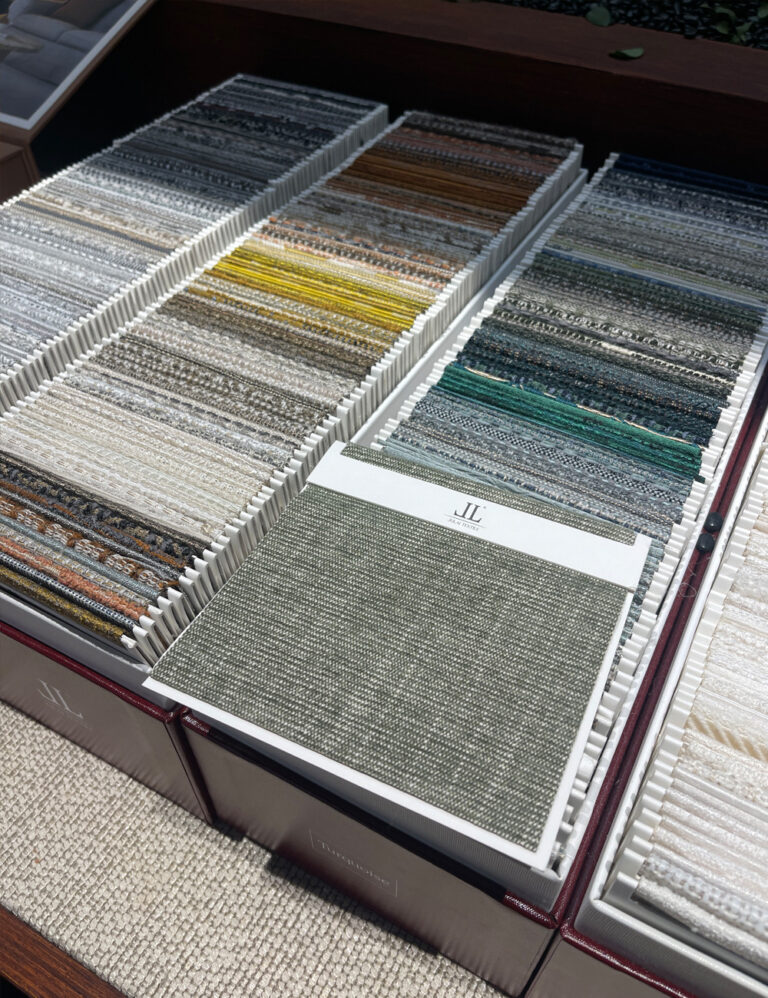 Textile swatch boxes with organized fabric color samples for showrooms
