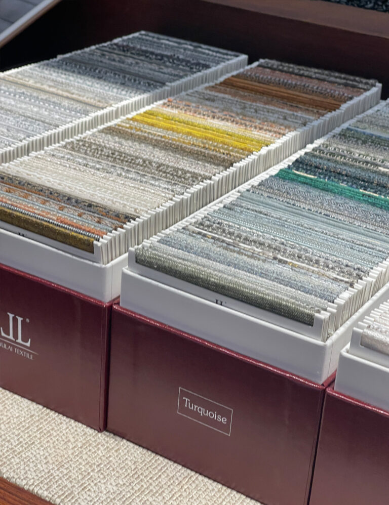 Organized fabric swatch samples in display boxes for curtain and upholstery